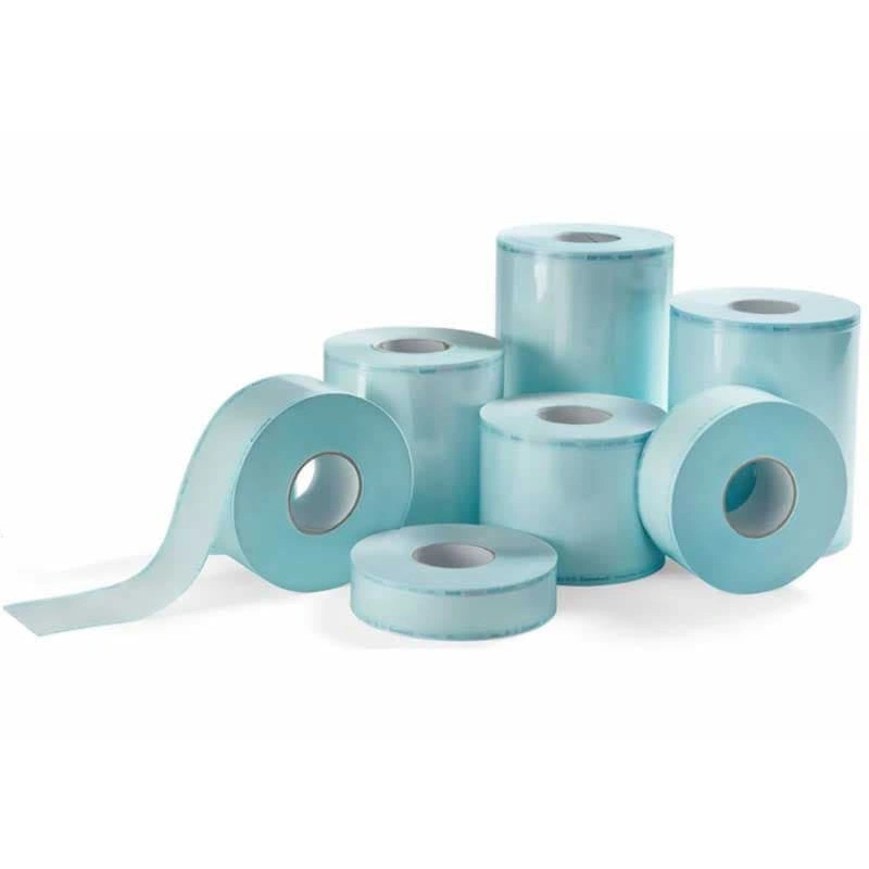 Several flat paper–film sterilization reels of different widths, including a partly unwound reel. Several flat paper–film sterilization reels of different widths, including a partly unwound reel.